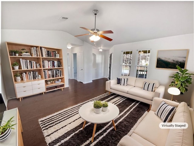 living room with dark wood-type flooring, lofted ceiling, and ceiling fan