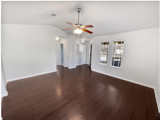 unfurnished room with ceiling fan, lofted ceiling, and dark hardwood / wood-style flooring