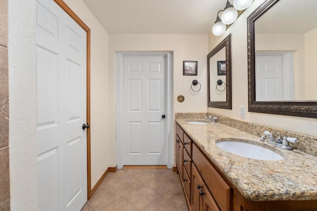 bathroom with vanity and tile patterned flooring