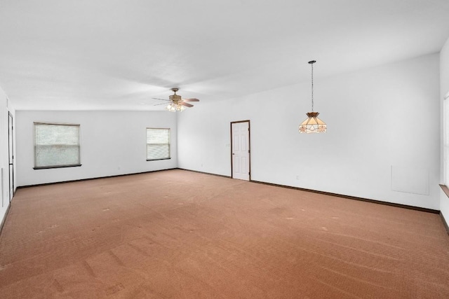 empty room featuring ceiling fan and carpet floors