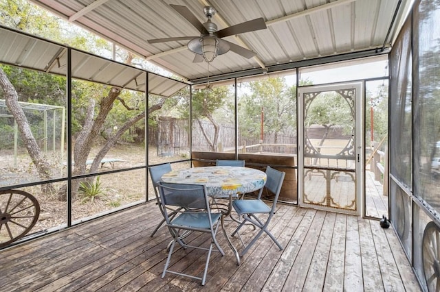 sunroom with a healthy amount of sunlight and ceiling fan