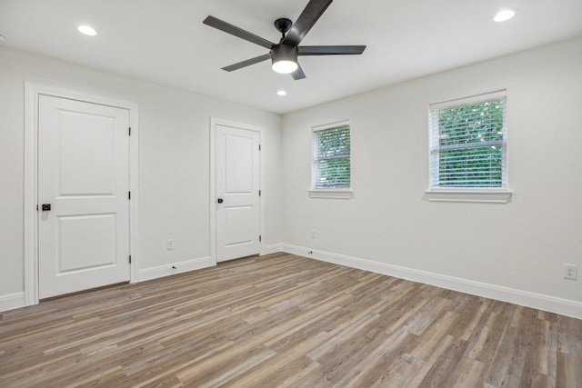 346 Webb St, Smithville, TX 78957 - unfurnished bedroom featuring baseboards, a ceiling fan, light wood finished floors, and recessed lighting