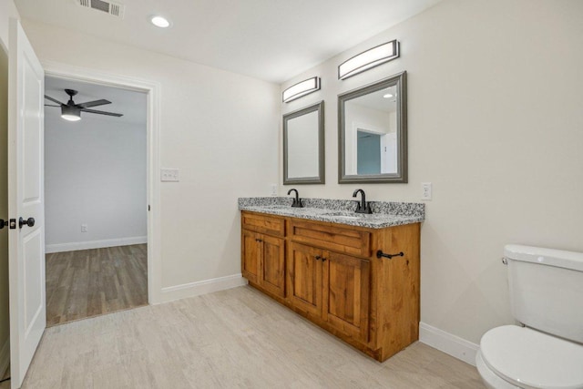 346 Webb St, Smithville, TX 78957 - bathroom with wood finished floors, visible vents, a sink, and toilet