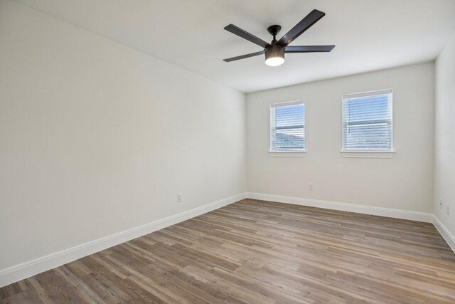 346 Webb St, Smithville, TX 78957 - unfurnished room featuring wood finished floors, a ceiling fan, and baseboards