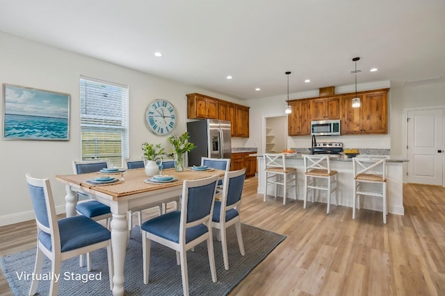 346 Webb St, Smithville, TX 78957 - dining area with light wood finished floors, baseboards, and recessed lighting