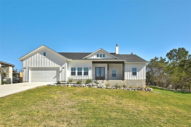 view of front of property with a front lawn and a garage