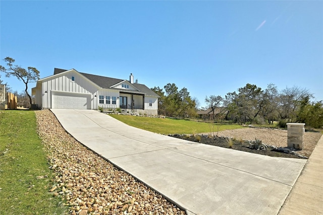 view of front of house with a garage and a front yard