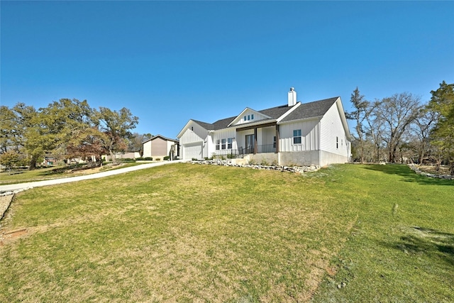 view of front of property with a front lawn and a garage