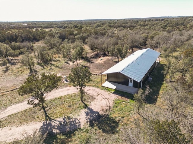 392 N Oak Vista Dr, Burnet, TX 78611 - aerial view of property and surrounding area featuring a heavily wooded area