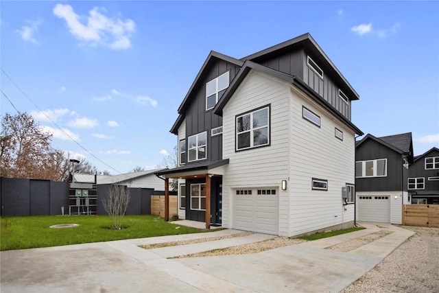 view of front of home featuring a front yard and a garage