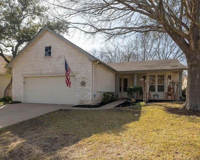 view of front facade with a garage and a front yard