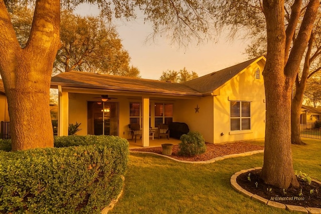216 Whispering Wind Dr, Georgetown, TX 78633 - back of property with stucco siding and a yard