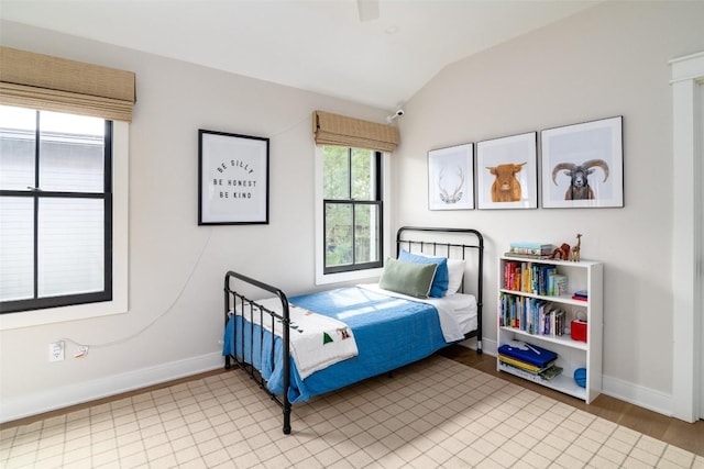 bedroom with lofted ceiling and ceiling fan