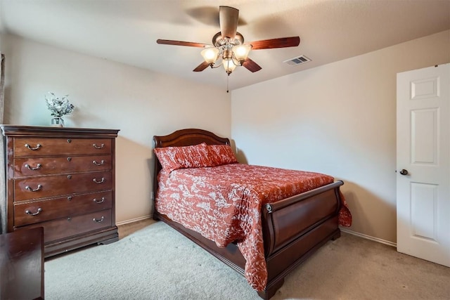 bedroom featuring light carpet and ceiling fan