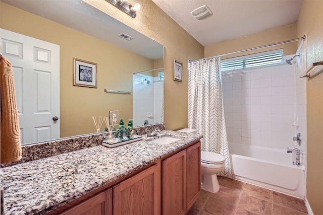 full bathroom featuring toilet, tile patterned floors, shower / tub combo with curtain, and vanity