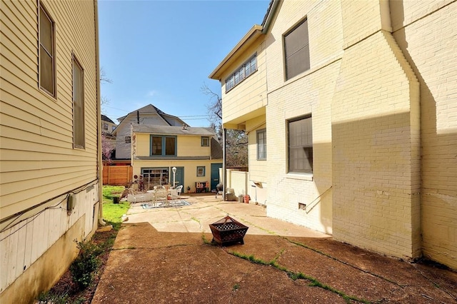 exterior space featuring an outdoor fire pit