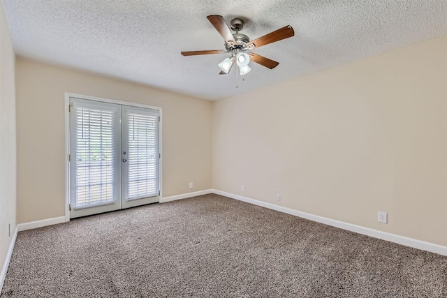 carpeted empty room with french doors, ceiling fan, a textured ceiling, and baseboards