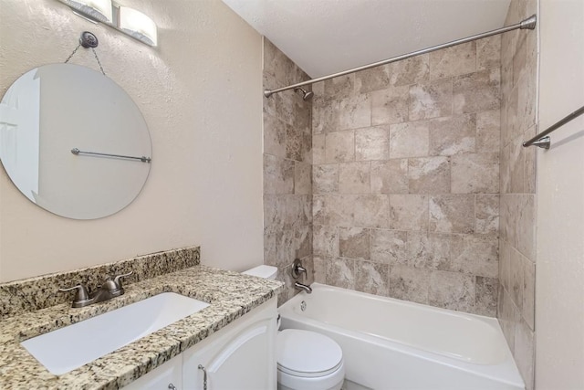 bathroom with toilet, shower / washtub combination, and vanity