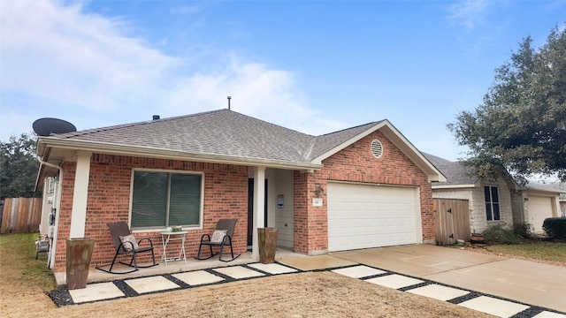 ranch-style house with a garage and covered porch