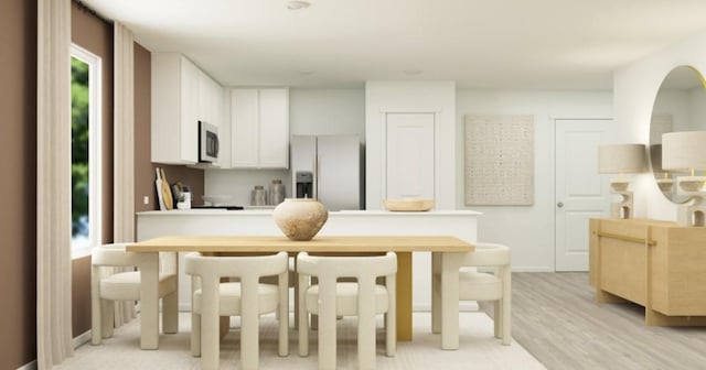 kitchen featuring white cabinetry, appliances with stainless steel finishes, and light hardwood / wood-style floors