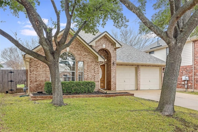 view of front of home with a garage and a front yard