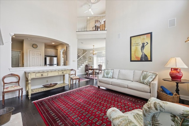 3800 Bailey Ln Unit F-1, Austin, TX 78756 - living room featuring a high ceiling, an inviting chandelier, and hardwood / wood-style floors