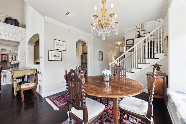 3800 Bailey Ln Unit F-1, Austin, TX 78756 - dining room featuring hardwood / wood-style flooring, crown molding, and an inviting chandelier