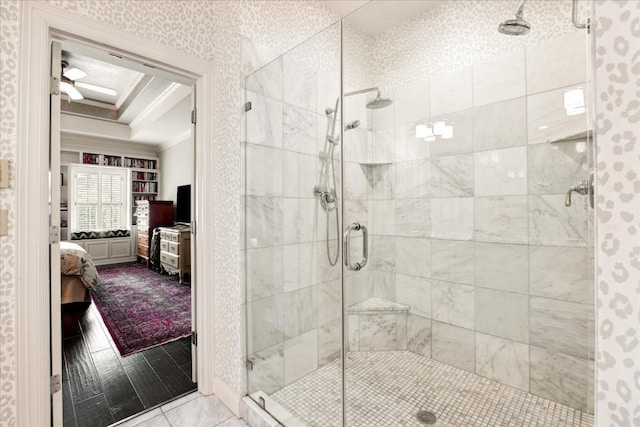 3800 Bailey Ln Unit F-1, Austin, TX 78756 - bathroom featuring a shower with shower door, tile patterned flooring, a tray ceiling, ceiling fan, and crown molding
