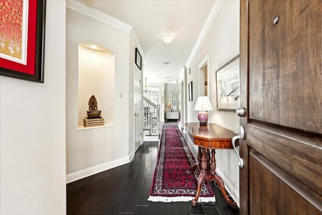 hallway with ornamental molding and dark wood-type flooring