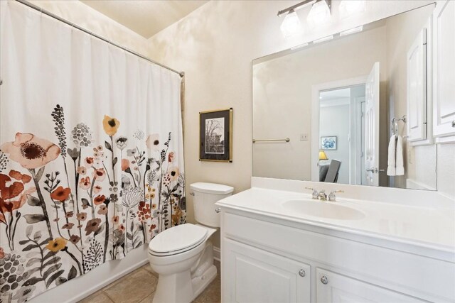 3800 Bailey Ln Unit F-1, Austin, TX 78756 - bathroom featuring toilet, tile patterned floors, and vanity
