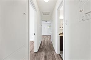 hallway featuring wood-type flooring