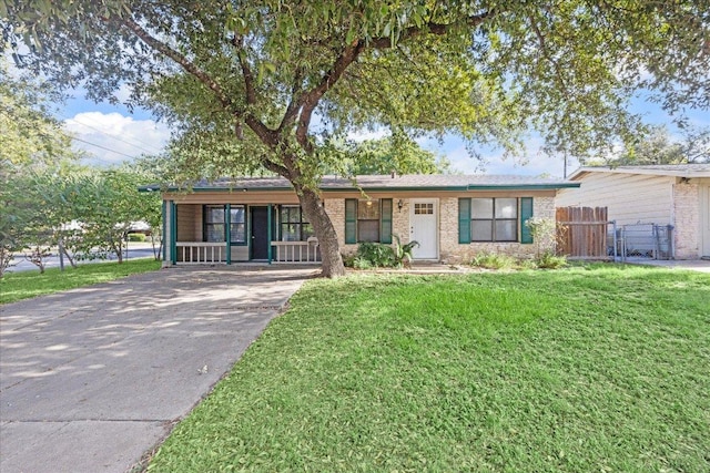 300 Tilbury Ln, Austin, TX 78745 - ranch-style house with a porch and concrete driveway