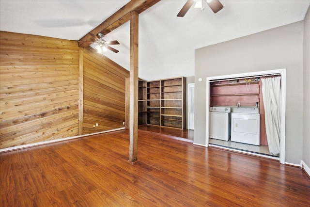 300 Tilbury Ln, Austin, TX 78745 - unfurnished living room featuring a ceiling fan, washer and dryer, wood walls, wood finished floors, and built in features