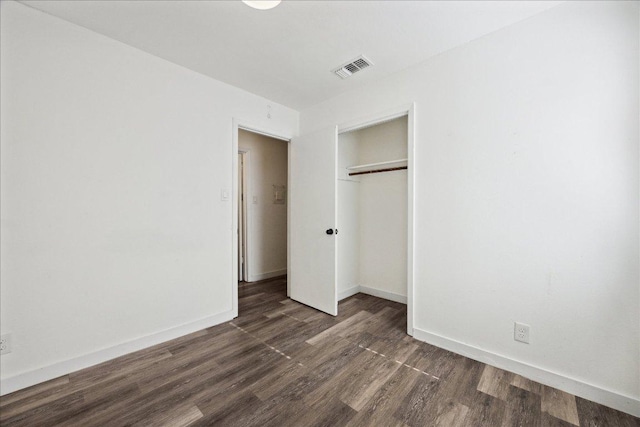 300 Tilbury Ln, Austin, TX 78745 - unfurnished bedroom with dark wood-style floors and a closet