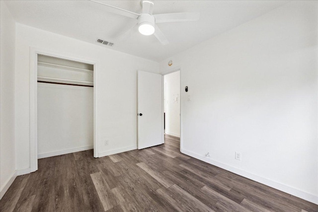 300 Tilbury Ln, Austin, TX 78745 - unfurnished bedroom featuring dark wood finished floors, a closet, and a ceiling fan