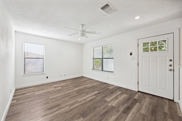 300 Tilbury Ln, Austin, TX 78745 - foyer entrance featuring wood finished floors, a textured ceiling, a ceiling fan, and recessed lighting