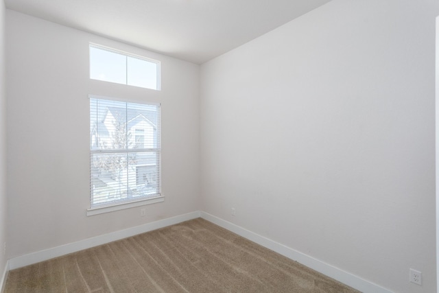 carpeted empty room featuring a healthy amount of sunlight