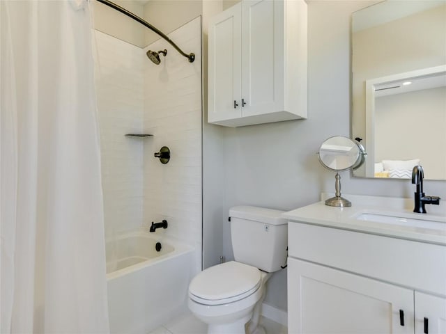 full bathroom featuring tiled shower / bath combo, toilet, and vanity