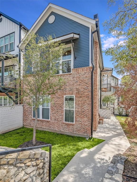 3809 Valley View Rd Unit 1, Austin, TX 78704 - back of house featuring a patio area and brick siding