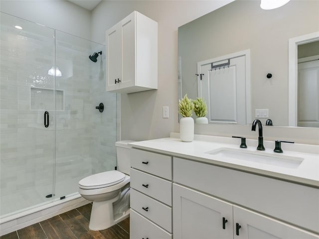 3809 Valley View Rd Unit 1, Austin, TX 78704 - full bathroom featuring vanity, a stall shower, and wood finished floors