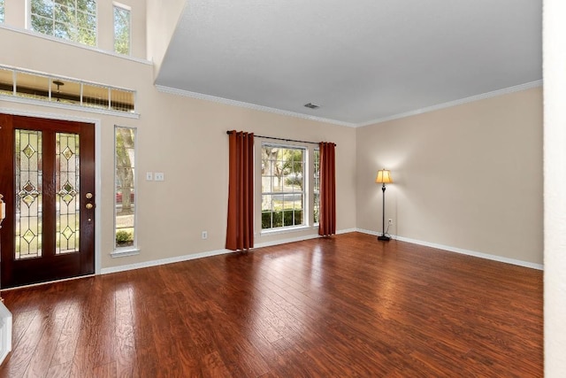 entrance foyer featuring ornamental molding and wood-type flooring