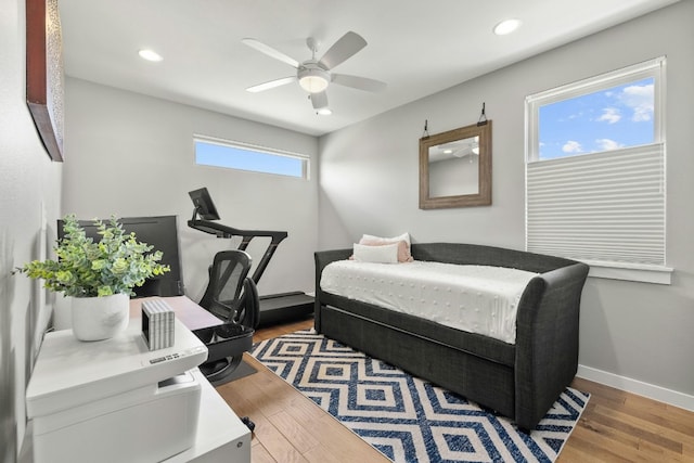 bedroom with hardwood / wood-style flooring and ceiling fan