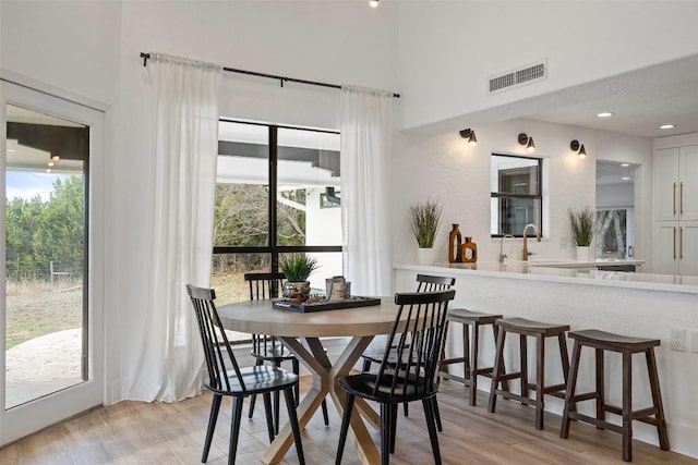 200 Shady River Rd, Wimberley, TX 78676 - dining space featuring a high ceiling and light wood-style floors
