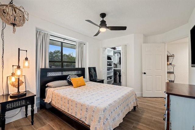 200 Shady River Rd, Wimberley, TX 78676 - bedroom with wood finished floors, a closet, a ceiling fan, and baseboards