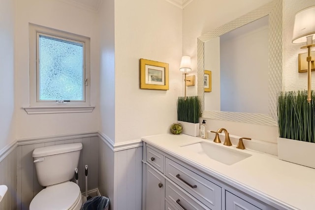 bathroom featuring toilet and vanity