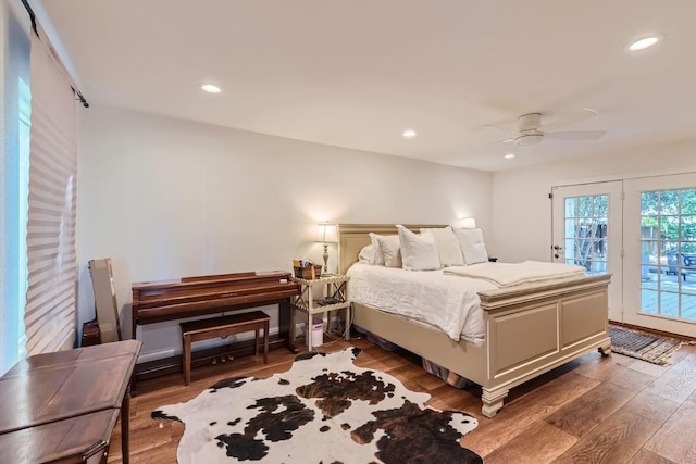 bedroom featuring ceiling fan, access to outside, and dark hardwood / wood-style floors