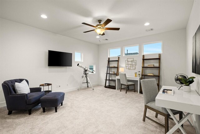 office space featuring visible vents, baseboards, recessed lighting, light carpet, and a ceiling fan