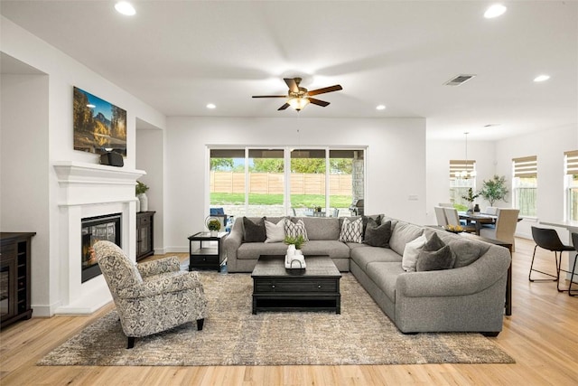 living area with visible vents, recessed lighting, wood finished floors, and a ceiling fan