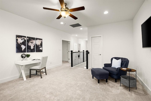 sitting room with recessed lighting, an upstairs landing, visible vents, and light colored carpet