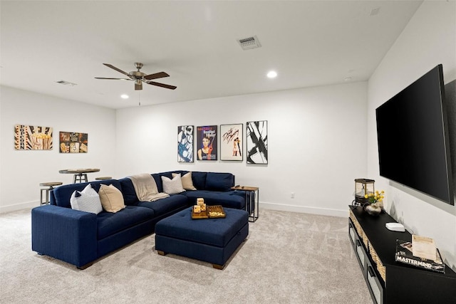 living area featuring visible vents, a ceiling fan, recessed lighting, and light carpet
